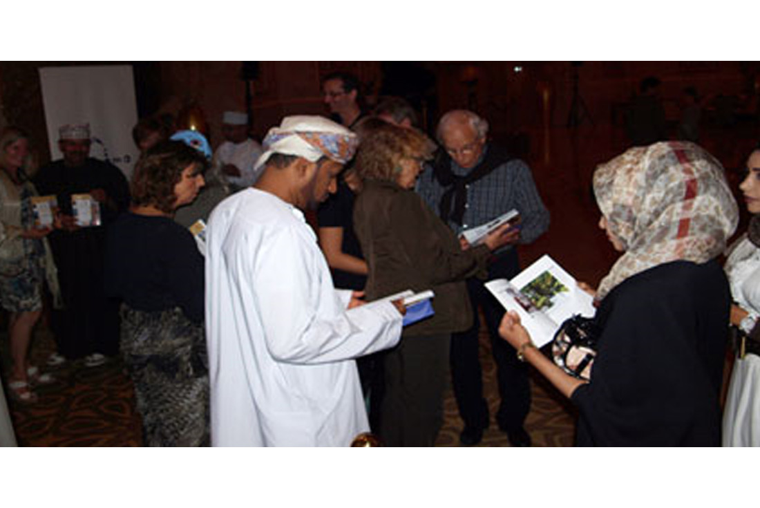 Guests enjoying their complimentary copy of 101 Things to See and Do in Oman